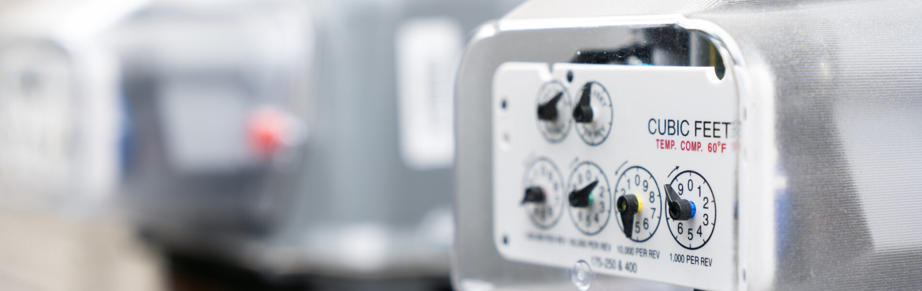 A row of grey natural gas meters at an apartment complex. The header for our supply transfer page.